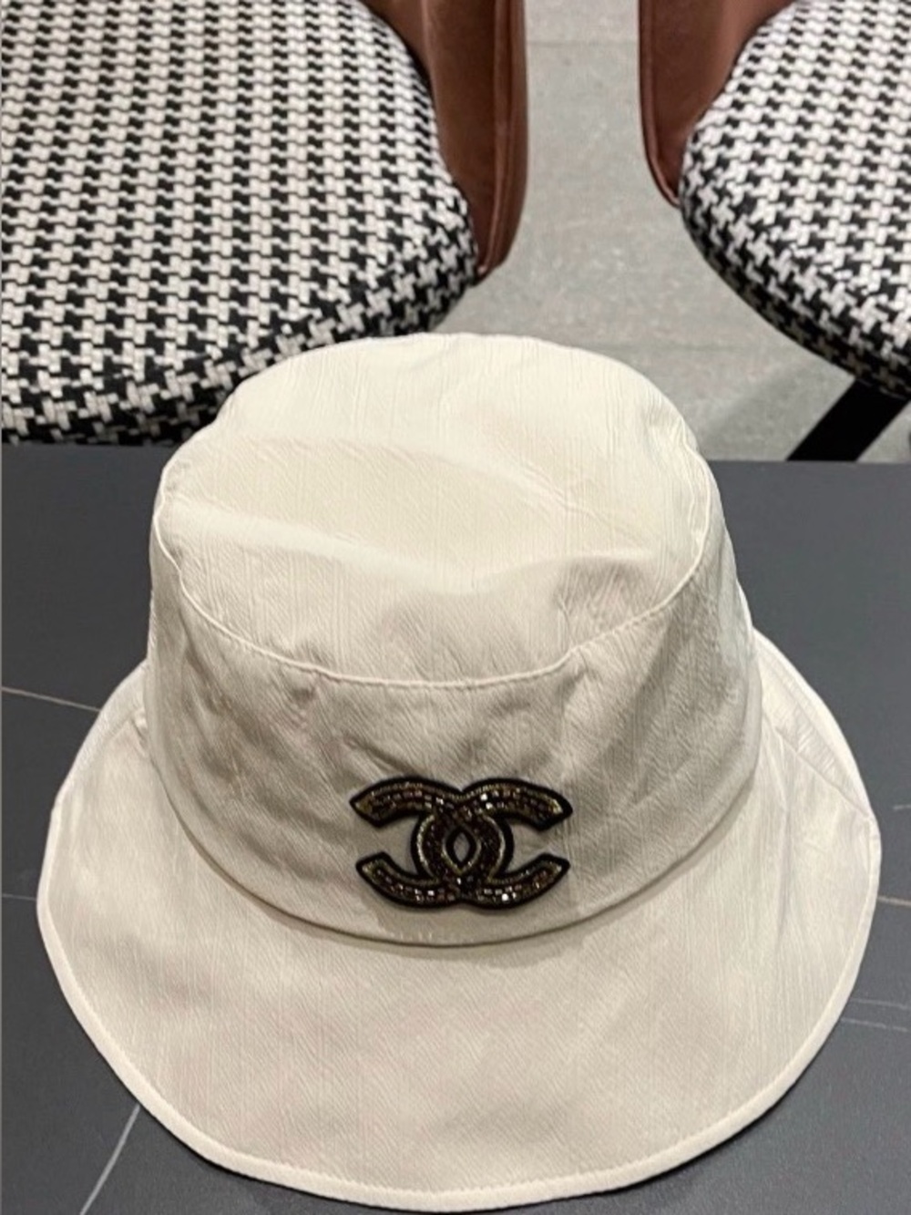 CHANEL Cream Bucket Hat with Black and Gold CC Logo